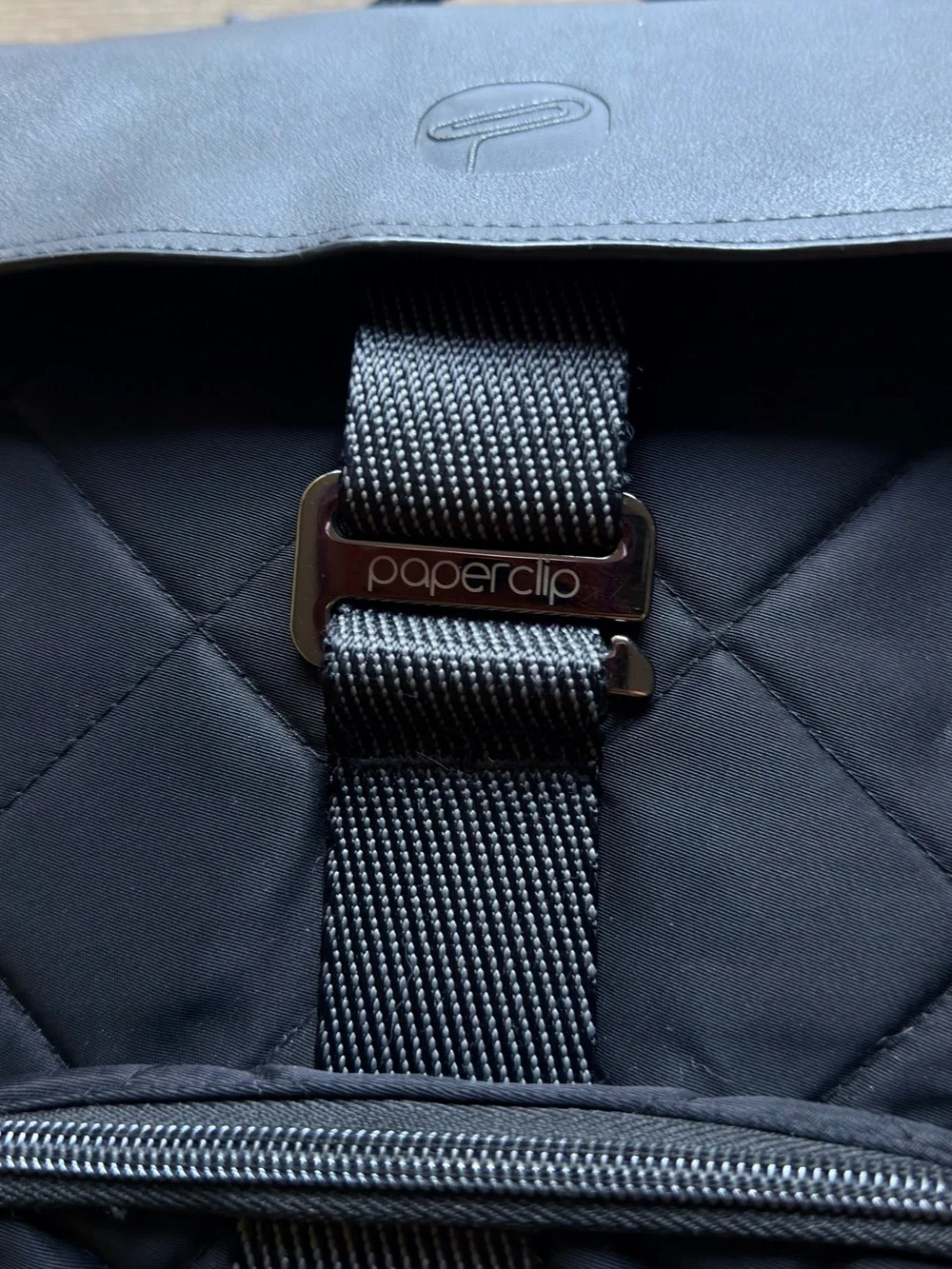 Black Quilted Roll-Top Backpack - [Brand]